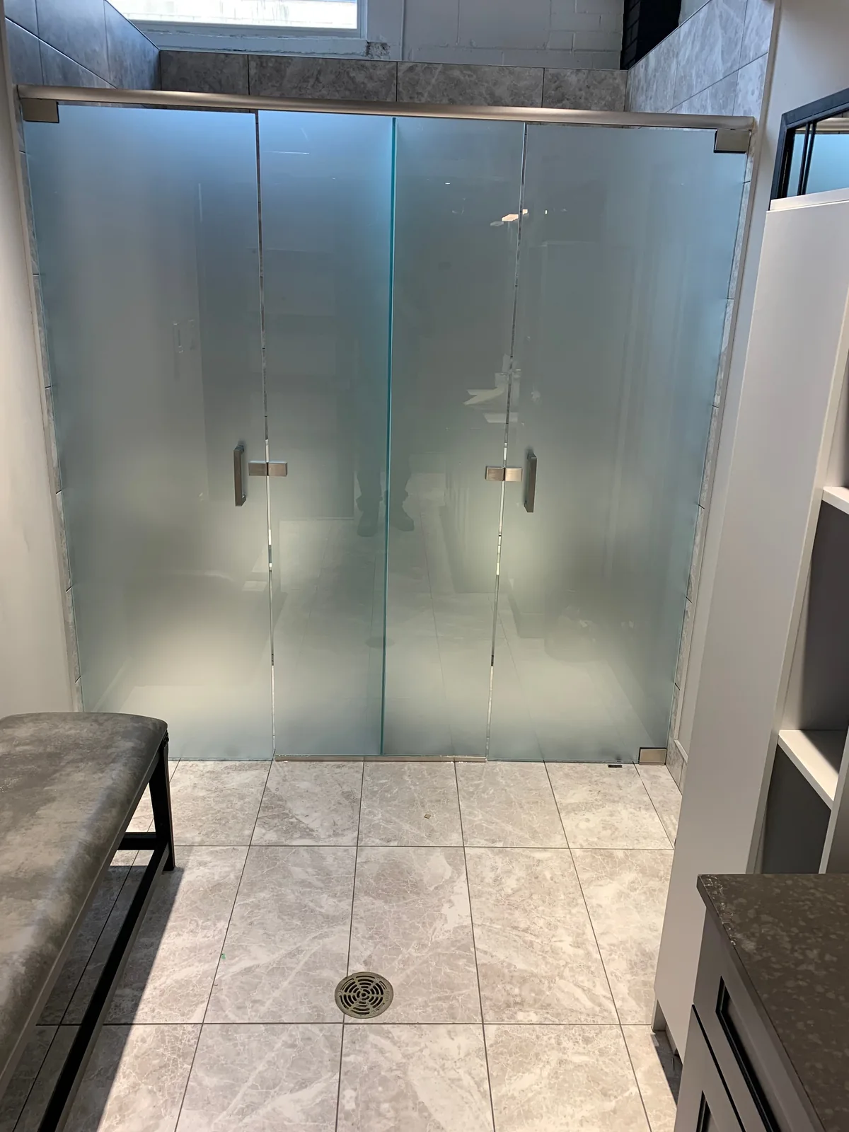 Glass shower enclosure